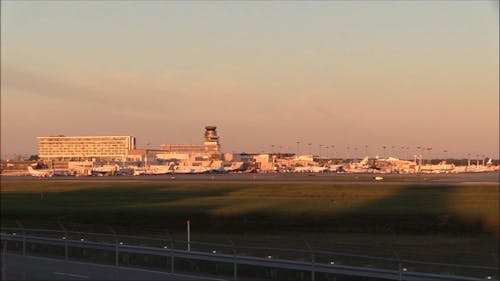 Airplanes Lining Up On The Airport Runway