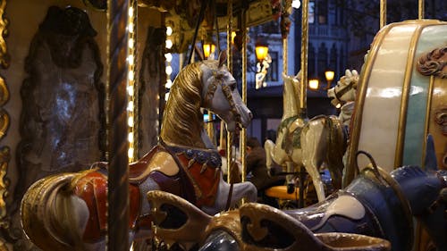 Wooden Sculptures Of Horses In A Carousel Ride