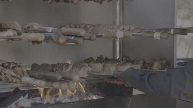 delicious barbecue meat grilling on open fire