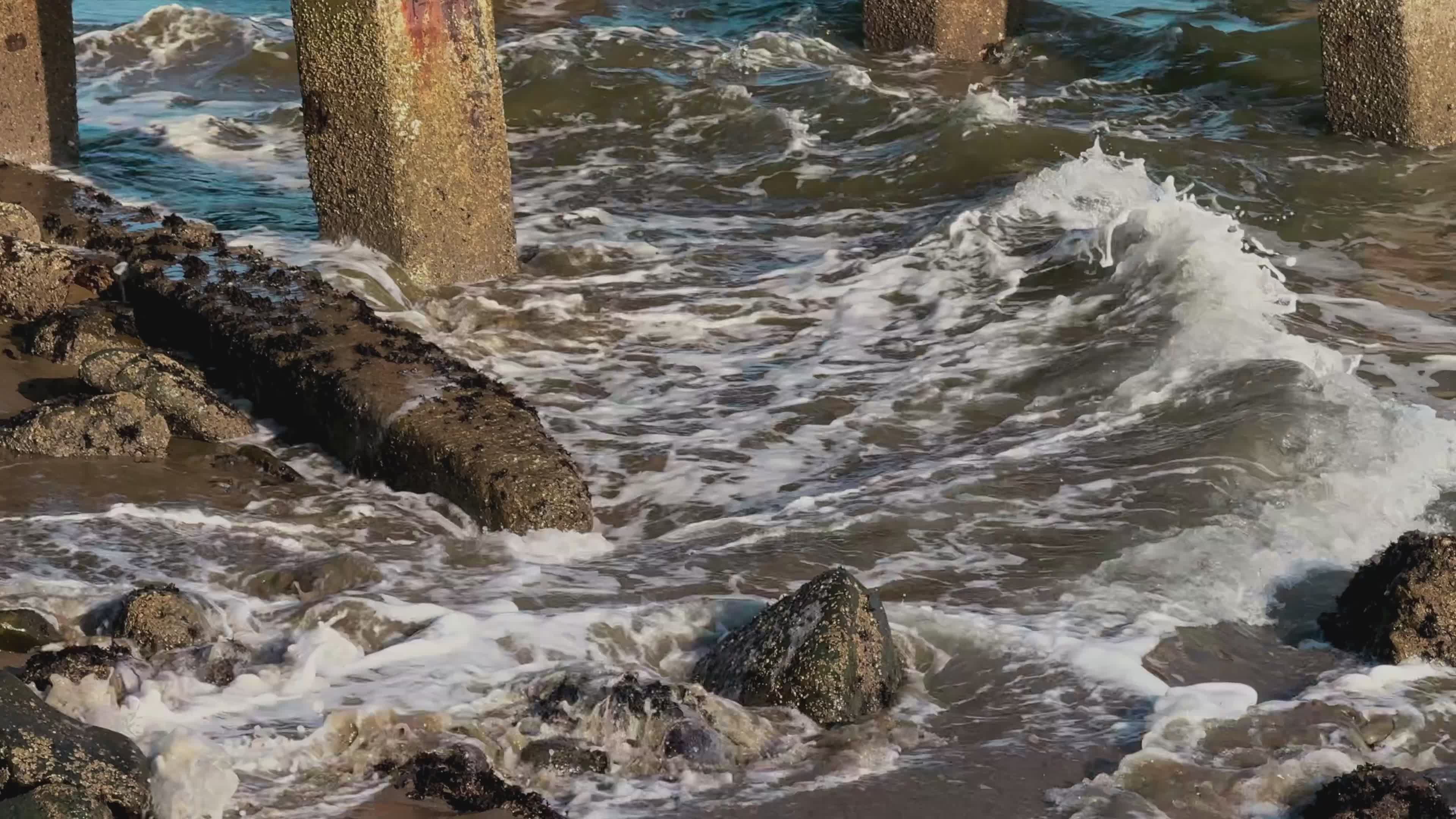 Waves Crashing on Rocky Ocean Shore near Pier Free Stock Video Footage ...