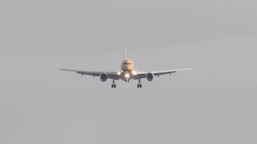 A Cargo Plane Descending On Air For The Landing