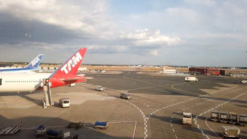 Passenger Airlines Docked On An Airport Terminal