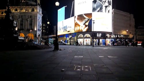 Lights From The Screen Of A Giant Electronic Billboard Brightening Up The Street