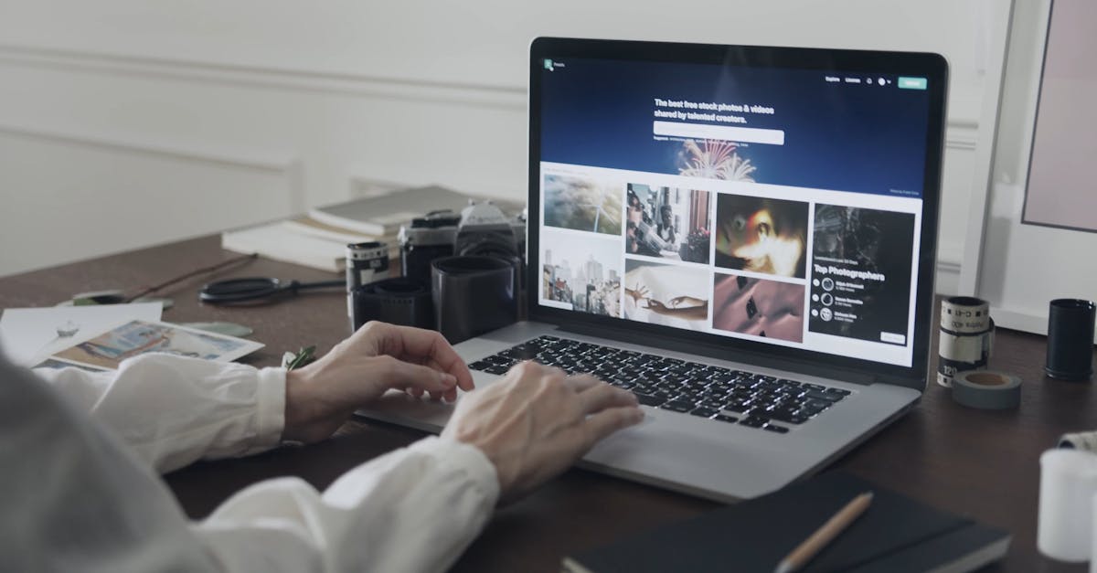 A Woman Scrolling For Pictures In A Laptop · Free Stock Video