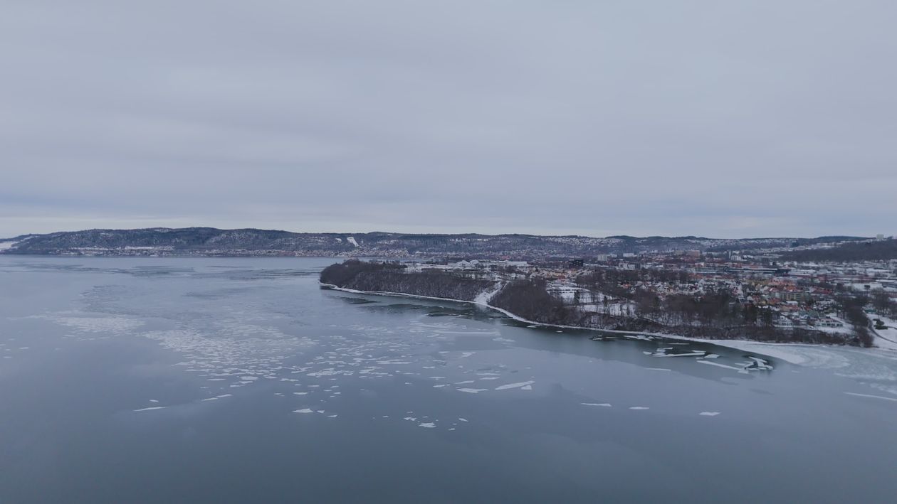 Aerial View of Winter Landscape Along Icy River Free Stock Video ...