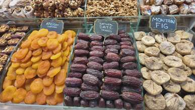 assorted dried fruits in market stall display