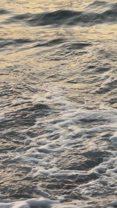 Andrea Mera Aguilar's ocean waves sunset video