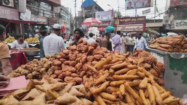 vibrant street food market scene in bangladesh