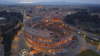 aerial view of colosseum at dawn