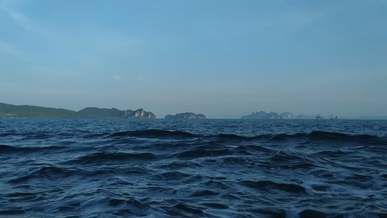 the view of the island from a moving boat