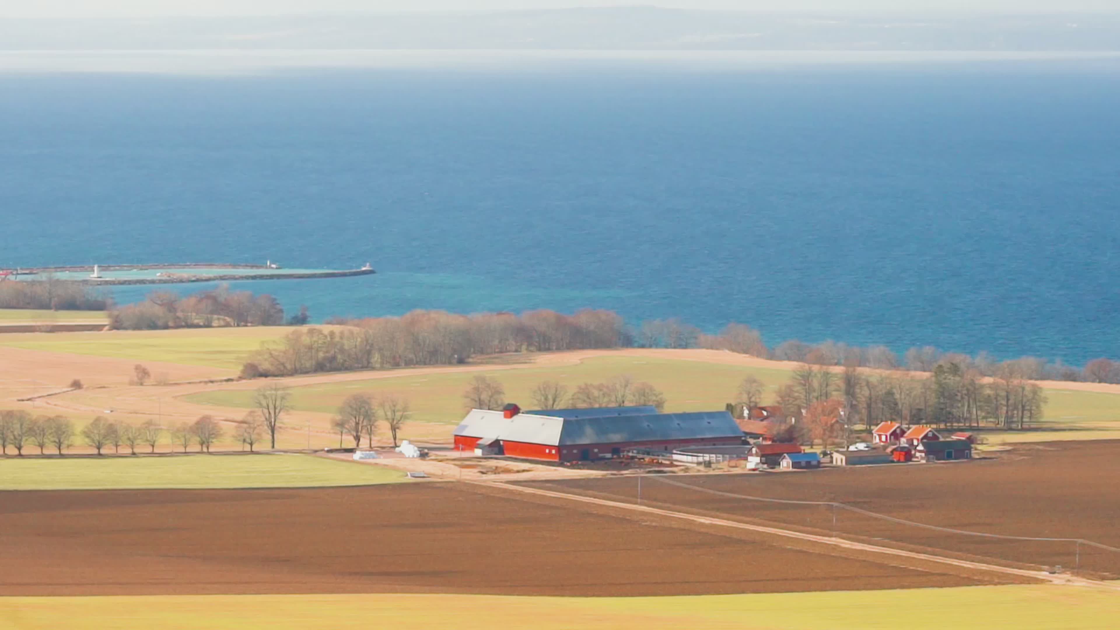 Aerial View of Coastal Farm with Ocean Background Free Stock Video ...