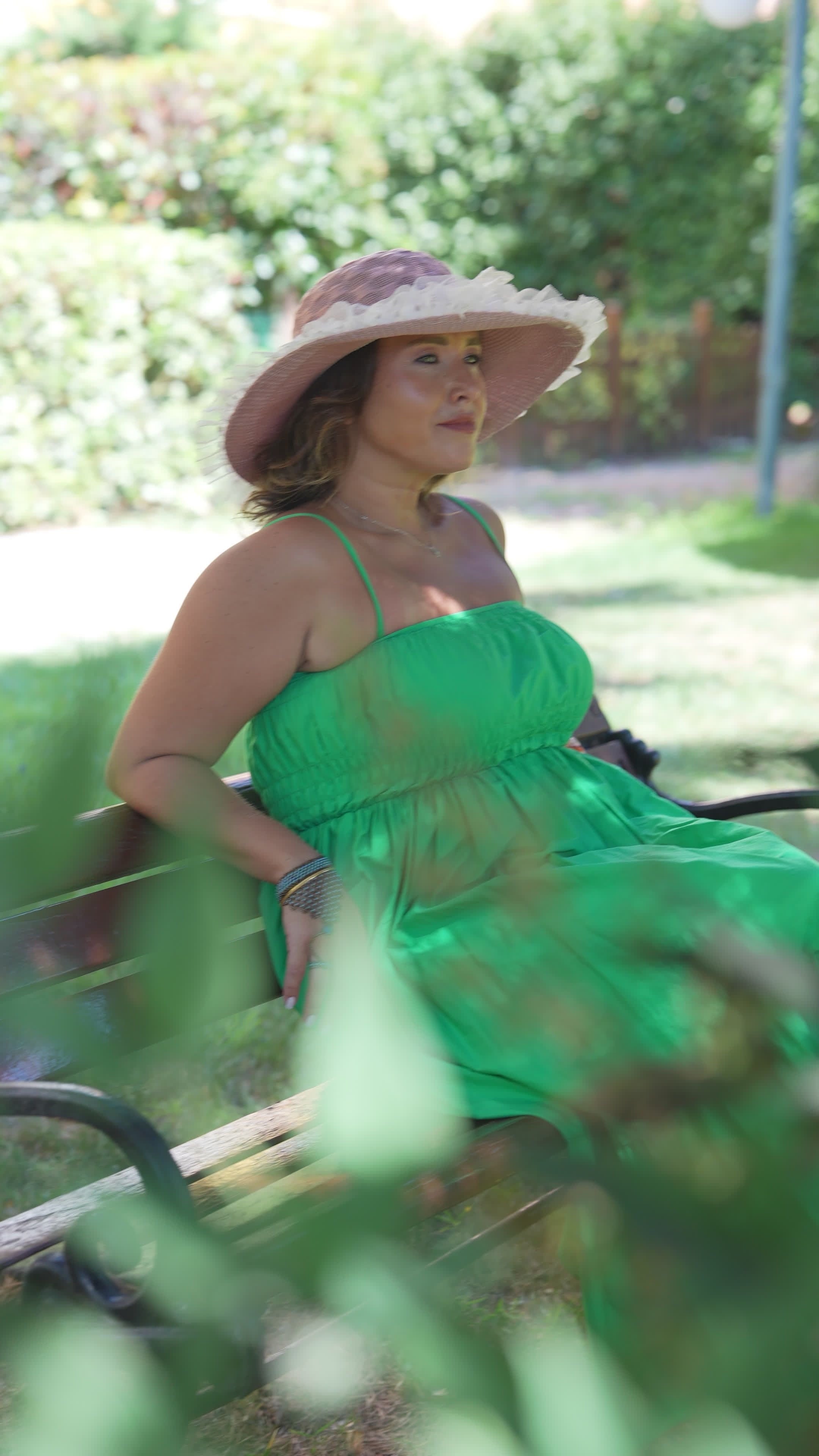 green dress video Woman Enjoying a Sunny Day in a Park