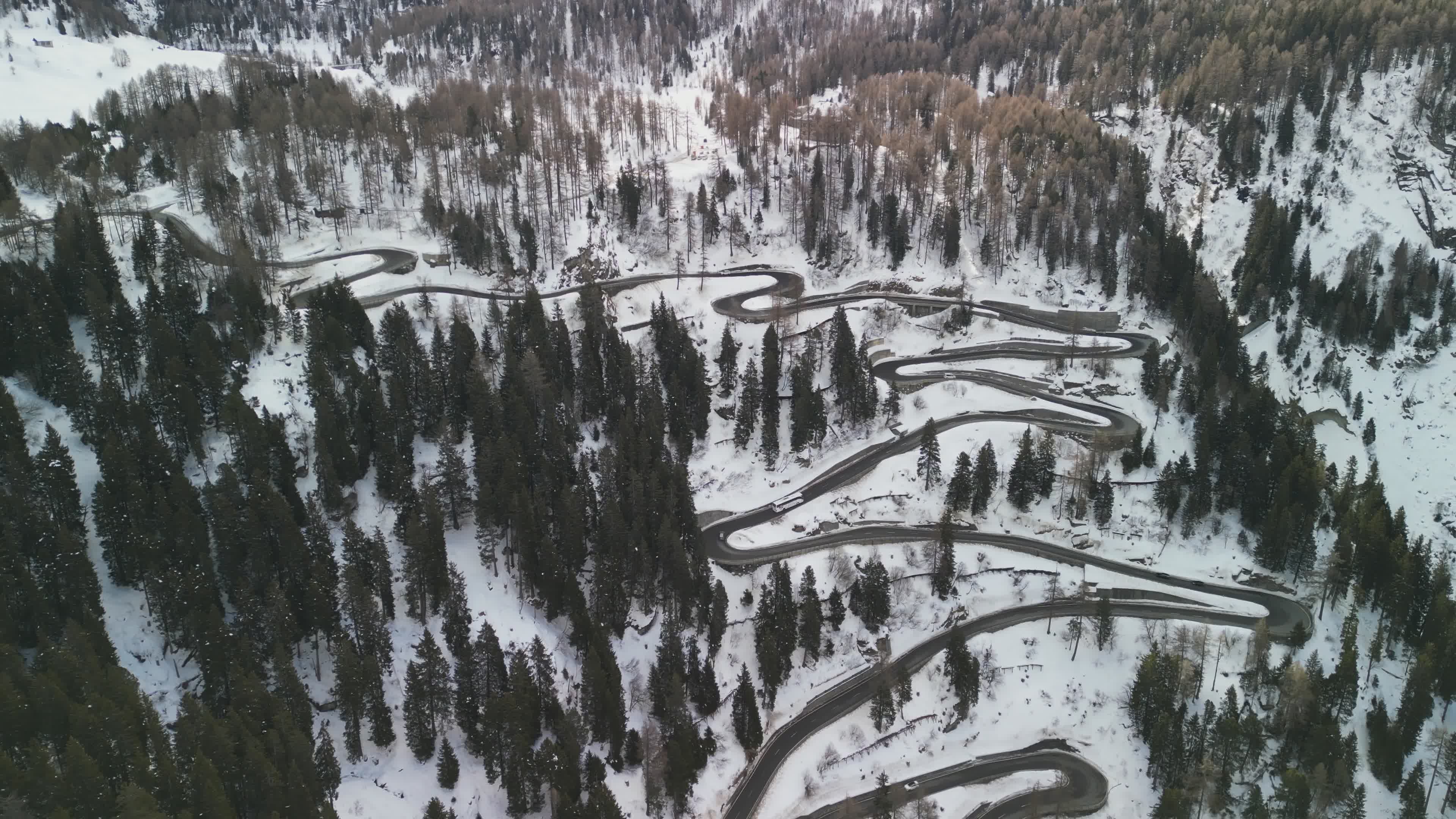 Aerial View of Snowy Mountain Road Curves Free Stock Video Footage ...