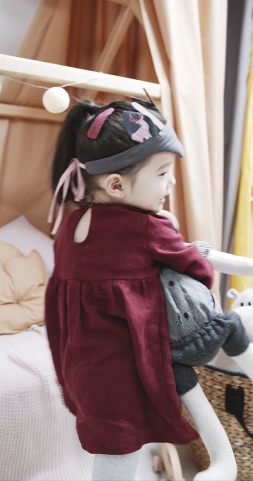 A Kid Cuddling A Stuffed Toy