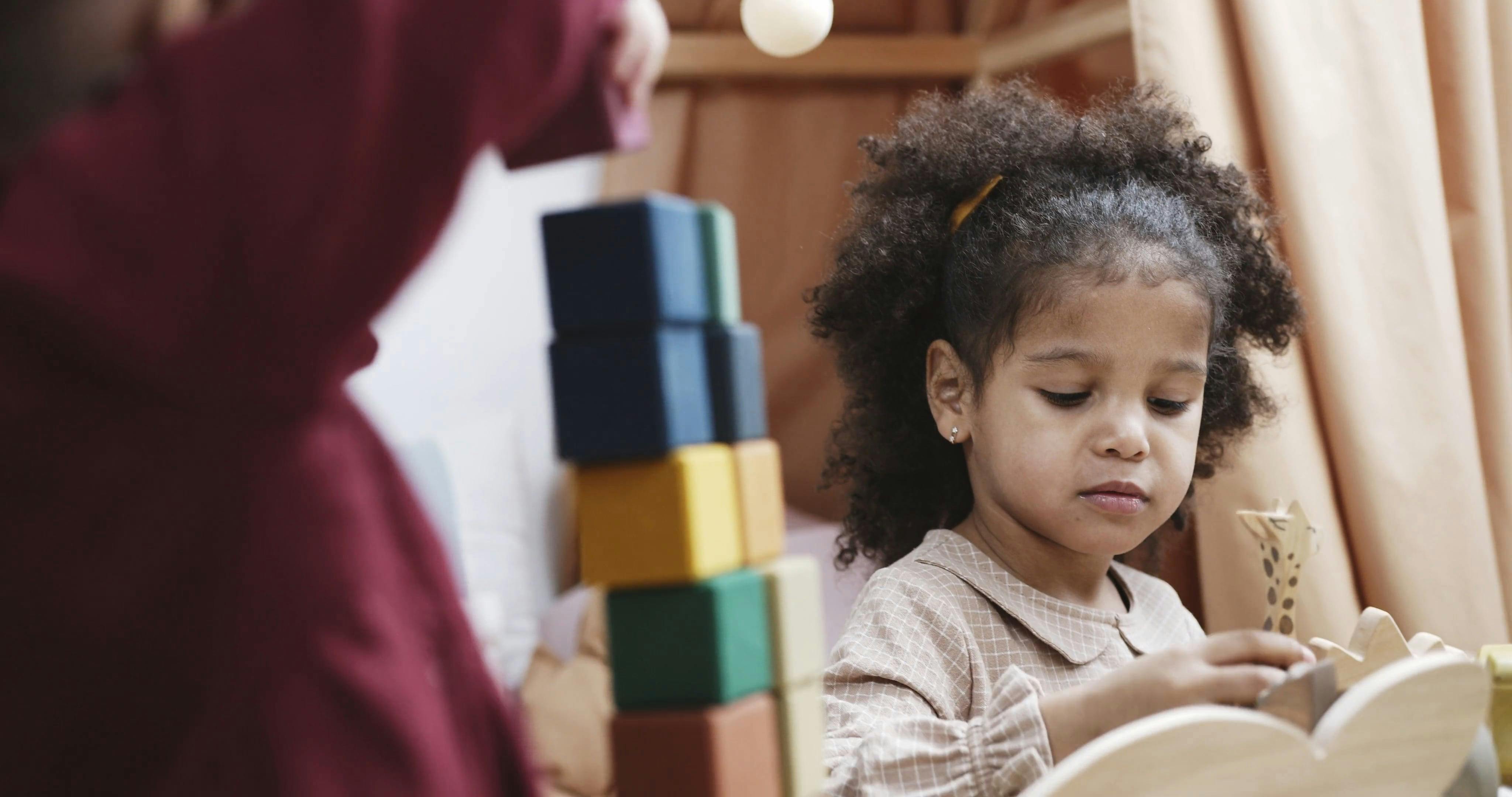 Two Girl Busy Playing With Toys Made Of Woods · Free Stock Video