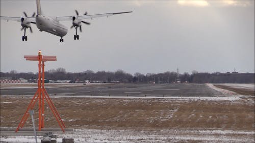 Watching The Airplane To Land In Runway