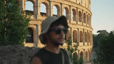 tourist admiring the colosseum in rome