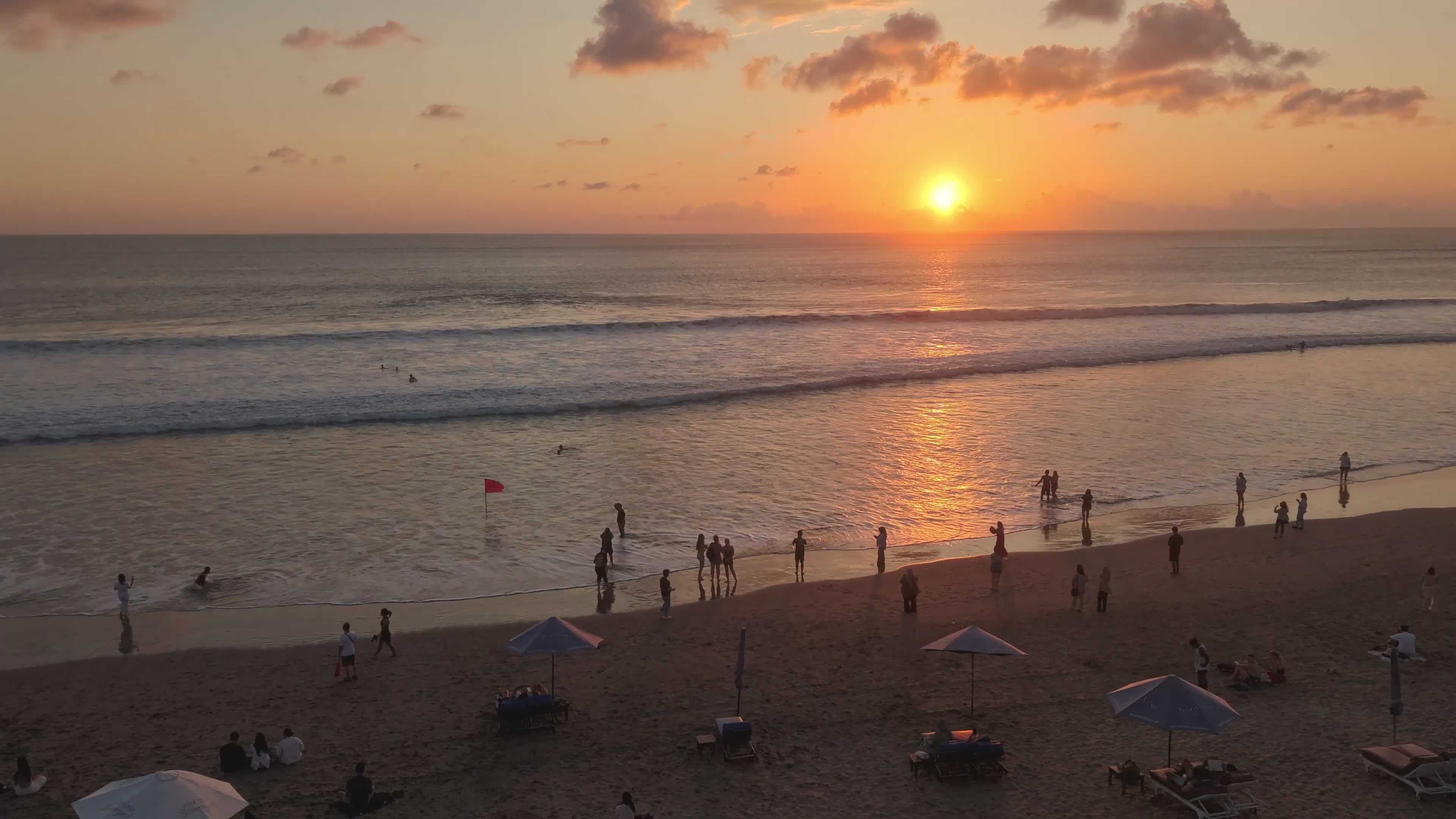 Serene Sunset Beach with People Enjoying the View Free Stock Video ...