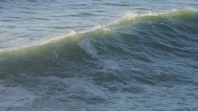 dynamic waves crashing on rocky coastline