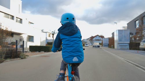Little Boy Riding A Bike