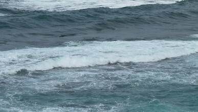 serene ocean waves crashing on rocky coast