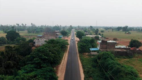 Aerial Shots Of A Road Crossing A Rural Area