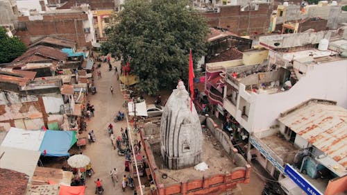 High Angle Footage Of The Town With People And Vehicle Passing by