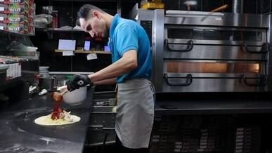 professional chef preparing delicious calzone