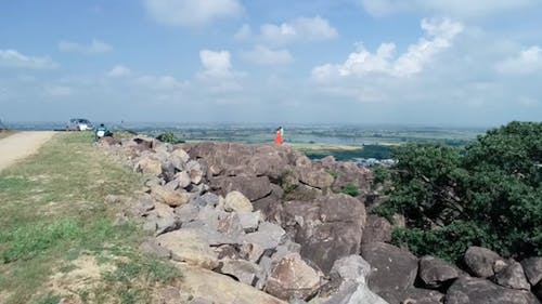 Drone Footage Of The Couple Standing On Rock