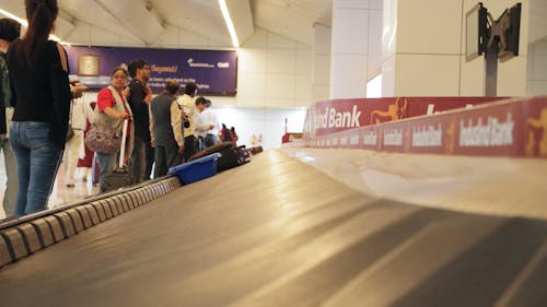 Footage Of People In The Airport Waiting For Their Luggage