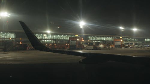 View Of An Airport's Tarmac At Nightime