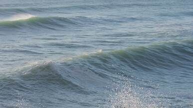 dynamic ocean waves crashing on rocky shore