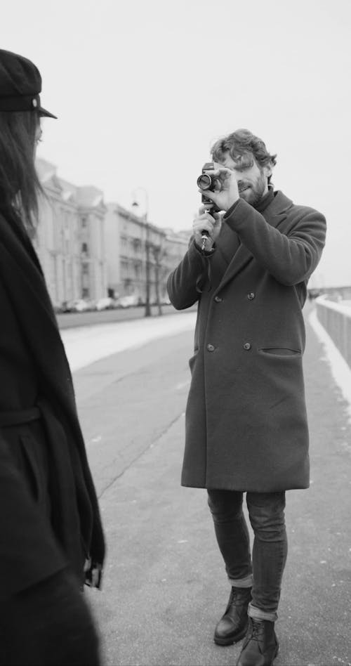 A Man Video Recording Her Partner While Having Fun Outdoor