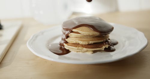 Plating Pancakes With Melted Chocolate Toppings