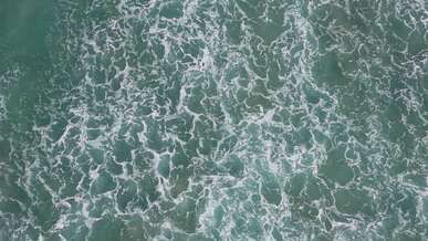 aerial view of turquoise ocean waves