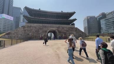 tourists visit south korea s namdaemun gate