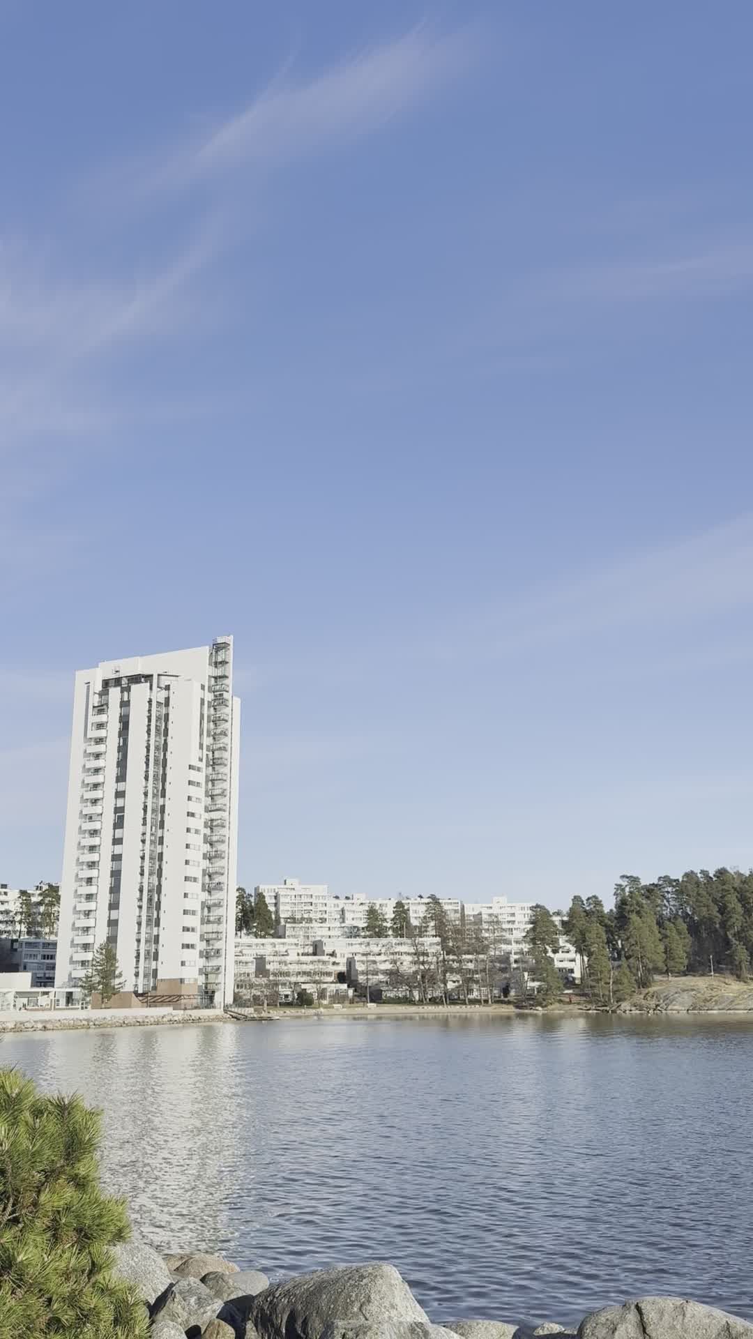 High-Rise Building by Riverside on a Clear Day Free Stock Video Footage ...