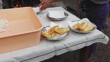 street food preparation with fried pastry