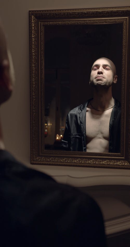 Reflection Of A Lonely  Man In The Mirror 