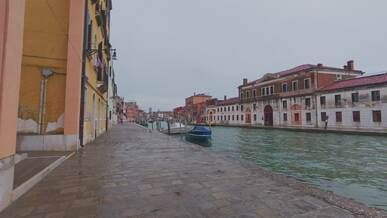 scenic venice canal walkway on overcast day