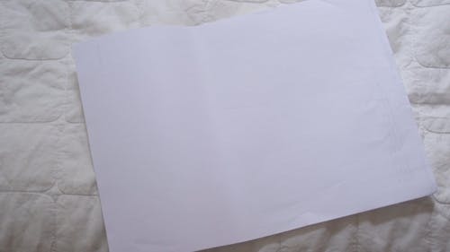 Person Drawing on a Paper