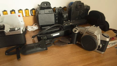 A Variety Of Cameras On The Table