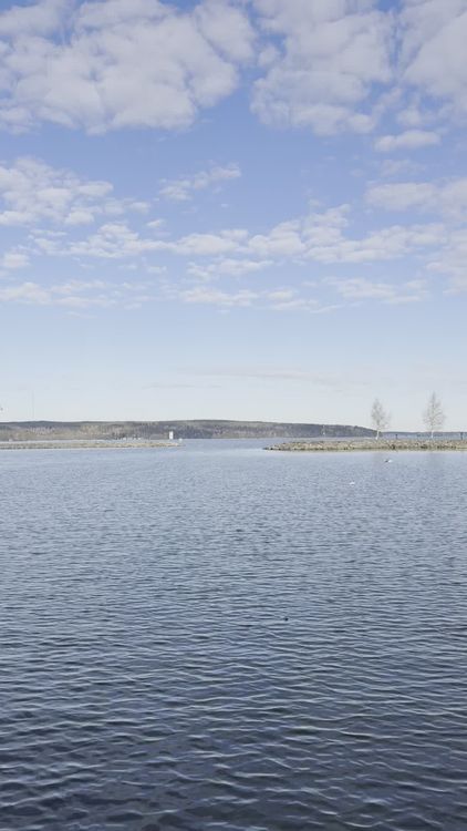 Serene Lake with Clear Blue Sky and Clouds Free Stock Video Footage ...