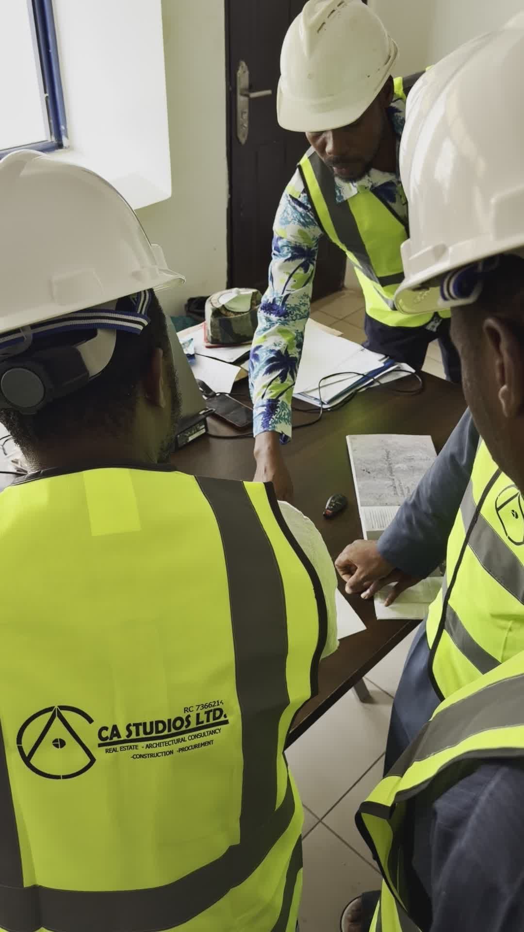 Team of Engineers Discussing Project Blueprints Free Stock Video ...