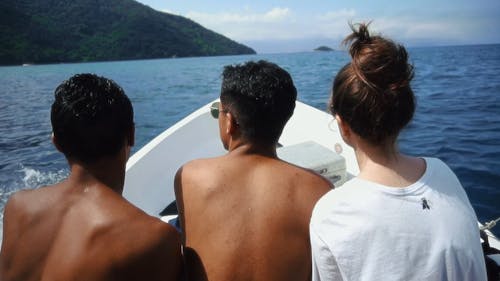 People Riding A Boat