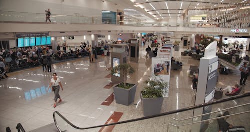 Travelers Crowding The Passengers Lounge In An Airport Terminal