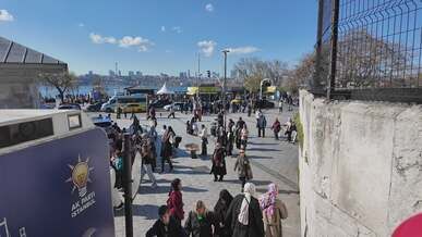 busy urban scene with people and buses