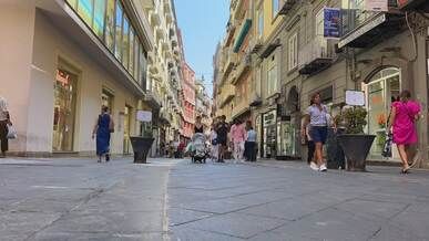 bustling european street with shoppers