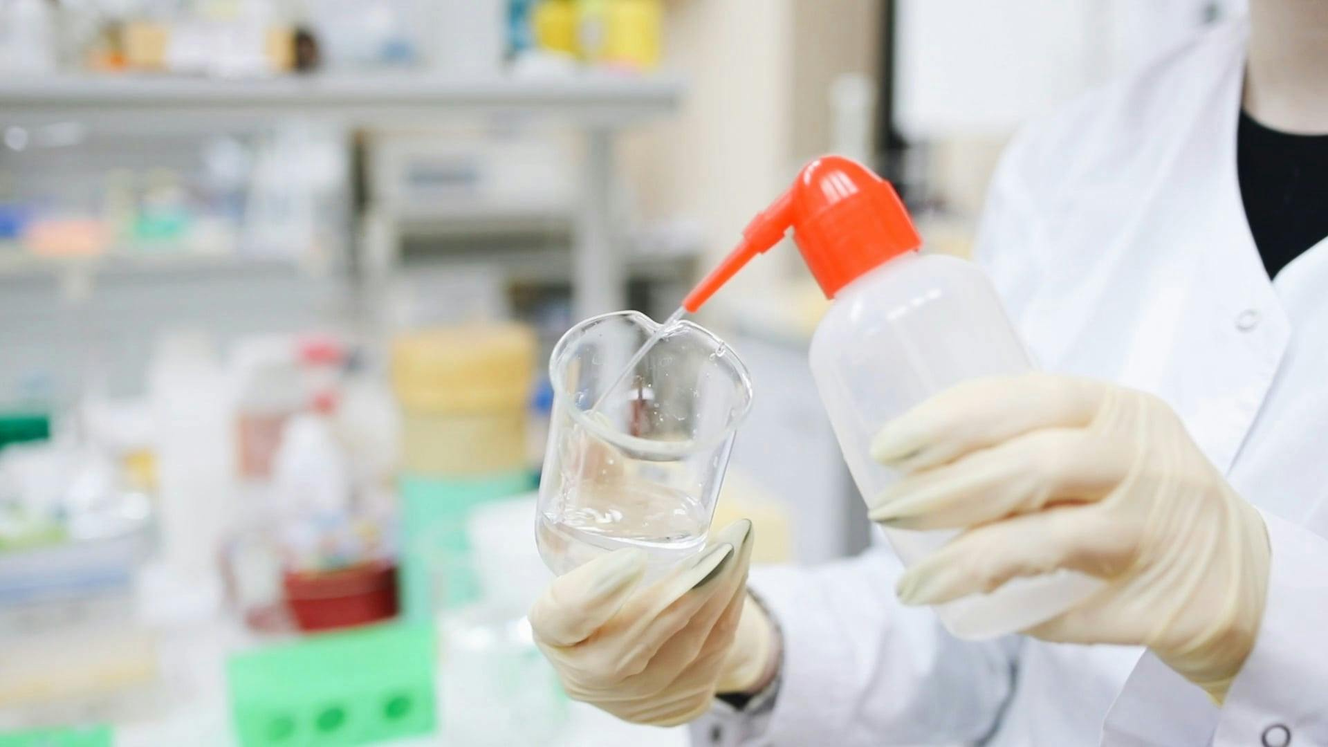 Footage Of A Woman Cleaning The Glass Beaker · Free Stock Video