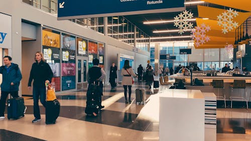 Travelers Inside An Airport Terminal